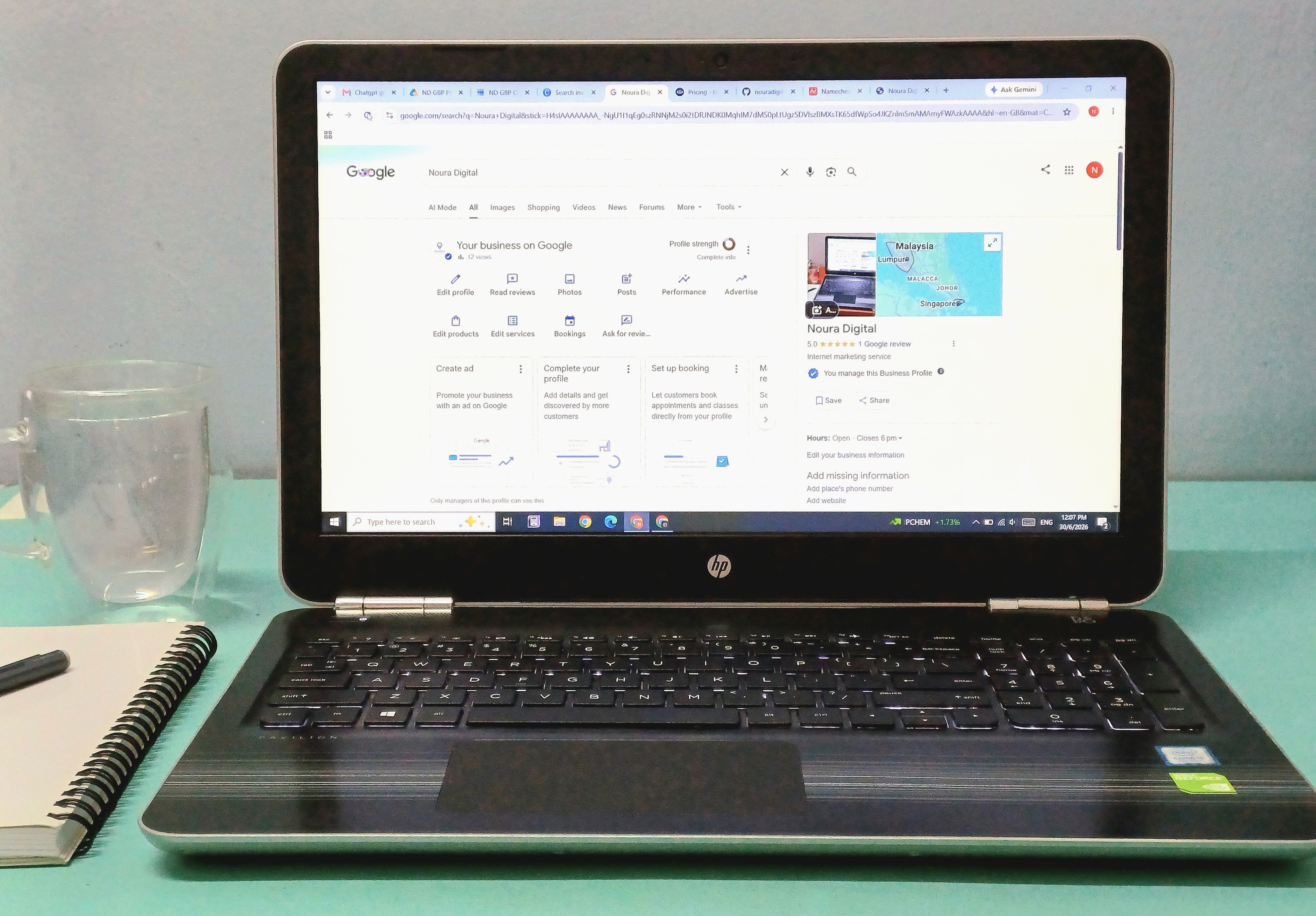 HP laptop showing Noura Digital Google Business Profile configuration dashboard